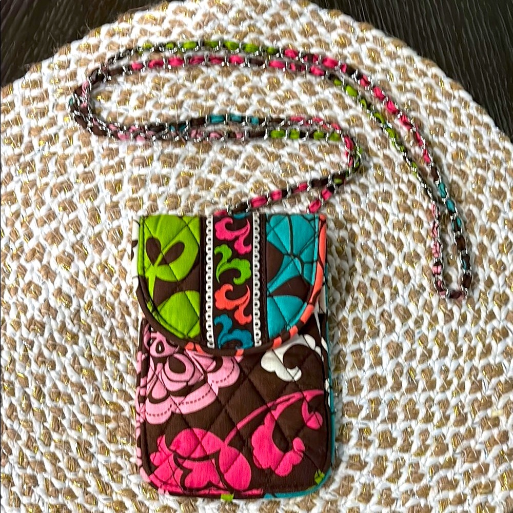 Vera Bradley Colorful Patterned Crossbody Bag with chain detailing.